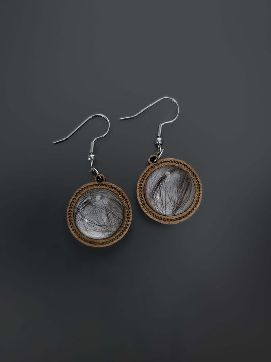 Close-up of wooden and resin dangle earrings
