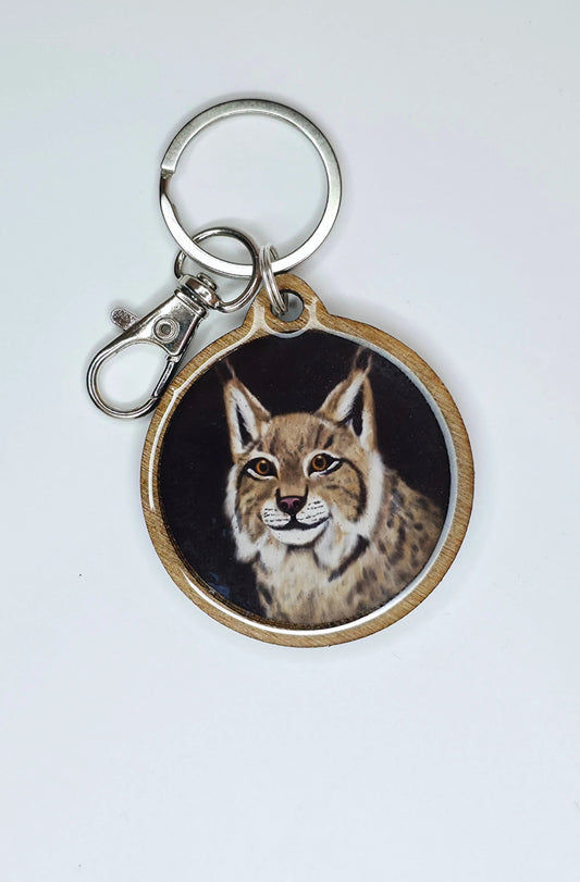 Musta Ilves-avaimenperä koivua ja epoksia