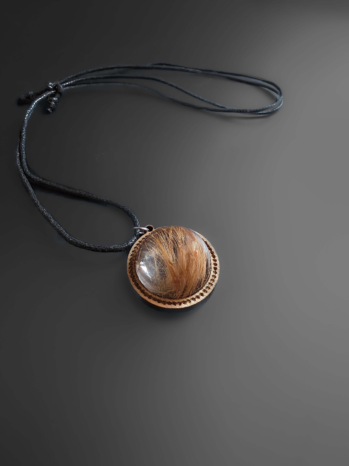 Memorial jewelry with wooden and resin charms on black cord
