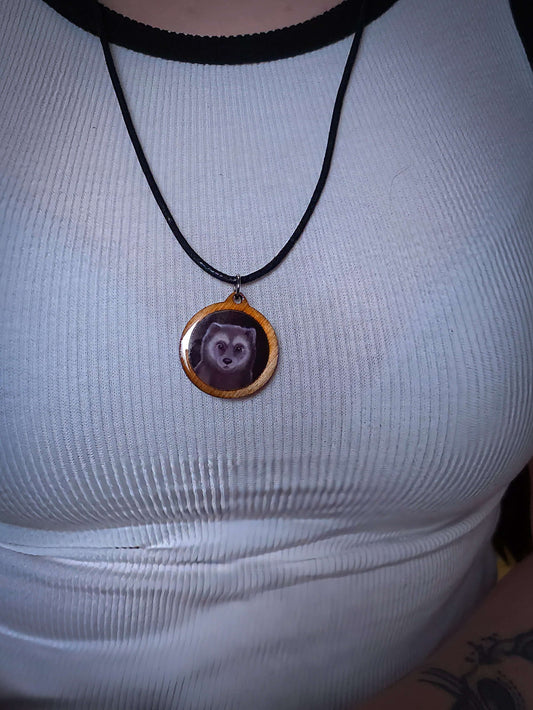 Wolf pendant necklace on white top, epoxy, Mäyrä