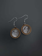 Close-up of wooden and resin dangle earrings